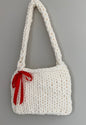 Handmade chunky knit bag with red bow